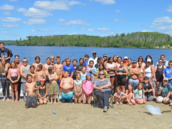 Youth and organizers gather at the community beach on Lake Mattagami
